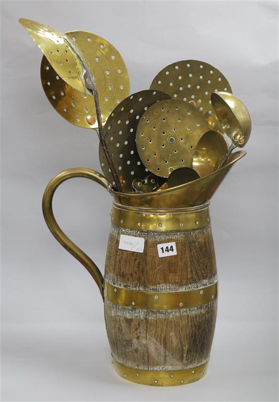 A collection 18th / 19th century brass and iron cream skimmers, ladles and a toasting fork & a staved and coopered brass mounted jug